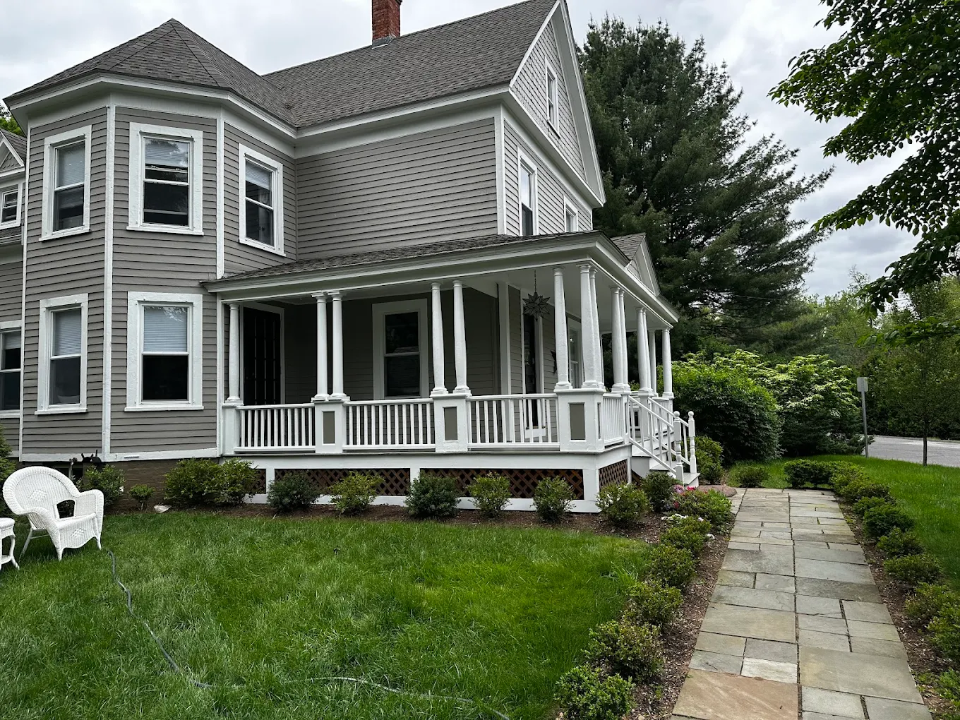 Exterior house painters applying premium paint finish
